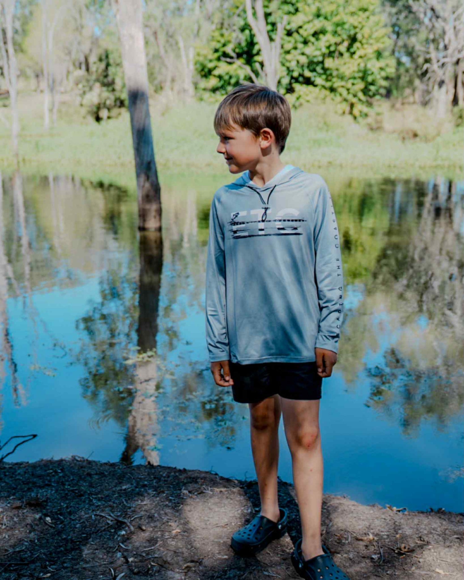 Kids performance long sleeve fishing shirt with water-resistant pockets and elastic hood, sun protection, no buff or thumb holes