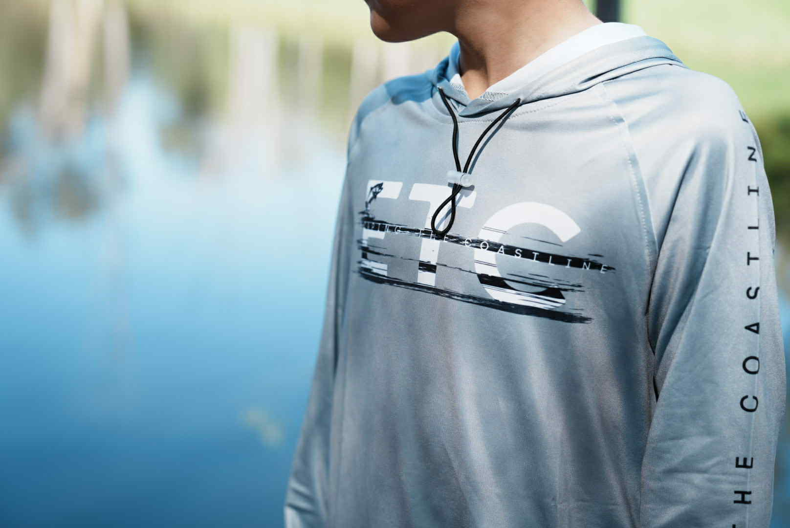 Kids performance long sleeve fishing shirt with water-resistant pockets and elastic hood, sun protection, no buff or thumb holes